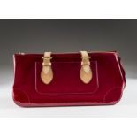 A modern red patent handbag marked Louis Vuitton, having tan coloured straps, in Louis Vuitton