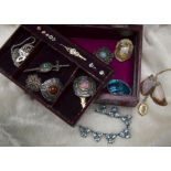 A collection of costume jewellery, including many pairs of earrings, a red jewellery box with