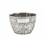 An Arts & Crafts period silver Christening bowl by George Unite, circular with raised floral panels,