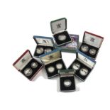 A collection of thirteen Royal Mint silver proof coins, including a Queen Mother centenary