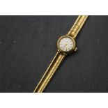 A 1960s 18ct gold Omega Ladymatic wristwatch, circular dial and case with integrated strap,
