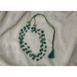 A modern emerald bead three strand necklace