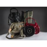 A Collection of eight fashion handbags and other bags all with wear from usage