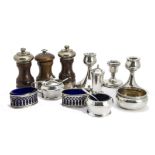 A collection of 20th century silver cruet items, along with a pair of silver filled dwarf