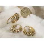 Three 9ct rings, including one larger coin style ring, a serpent wedding band lacking stones to