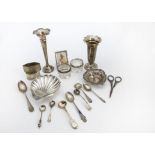 A collection of 19th and 20th century silver items, including a shell butter dish, two filled