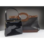 A 1980s black patent snap clasp handbag, together with a larger black and brown leather handbag from