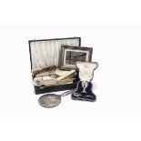 A collection of silver items, including a 1970s silver four piece dressing table set in case, a
