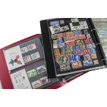 A collection of stamps and First Day Covers, including two vintage stamp albums, along with modern