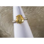 A modern 9ct gold fire opal ring, heightened by diamonds to shoulders, 2.7g and size N