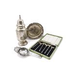 An Art Deco silver sugar castor, together with a Victorian silver shallow dish, a silver tea