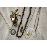 A collection of silver and other jewellery, including including a tigers eye bead necklace,