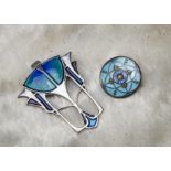 A modern Arts & Crafts style silver and enamelled brooch, together with a circular enamelled