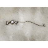 A Victorian or later diamond set necklace clasp, the central collet set old cut with mouth and