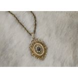 A modern 9ct gold seed pearl and garnet locket pendant, in a traditional style, on a gold plated