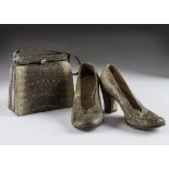 A vintage pair of snakeskin shoes and matching handbag, the small snap clasp doctor style handbag