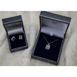 A modern 9ct white gold amethyst and diamond pendant and earrings set, octagonal mounts set with