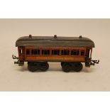 An Early Bing O Gauge Continental Speisewagen Bogie Coach, in orange/teak livery with green