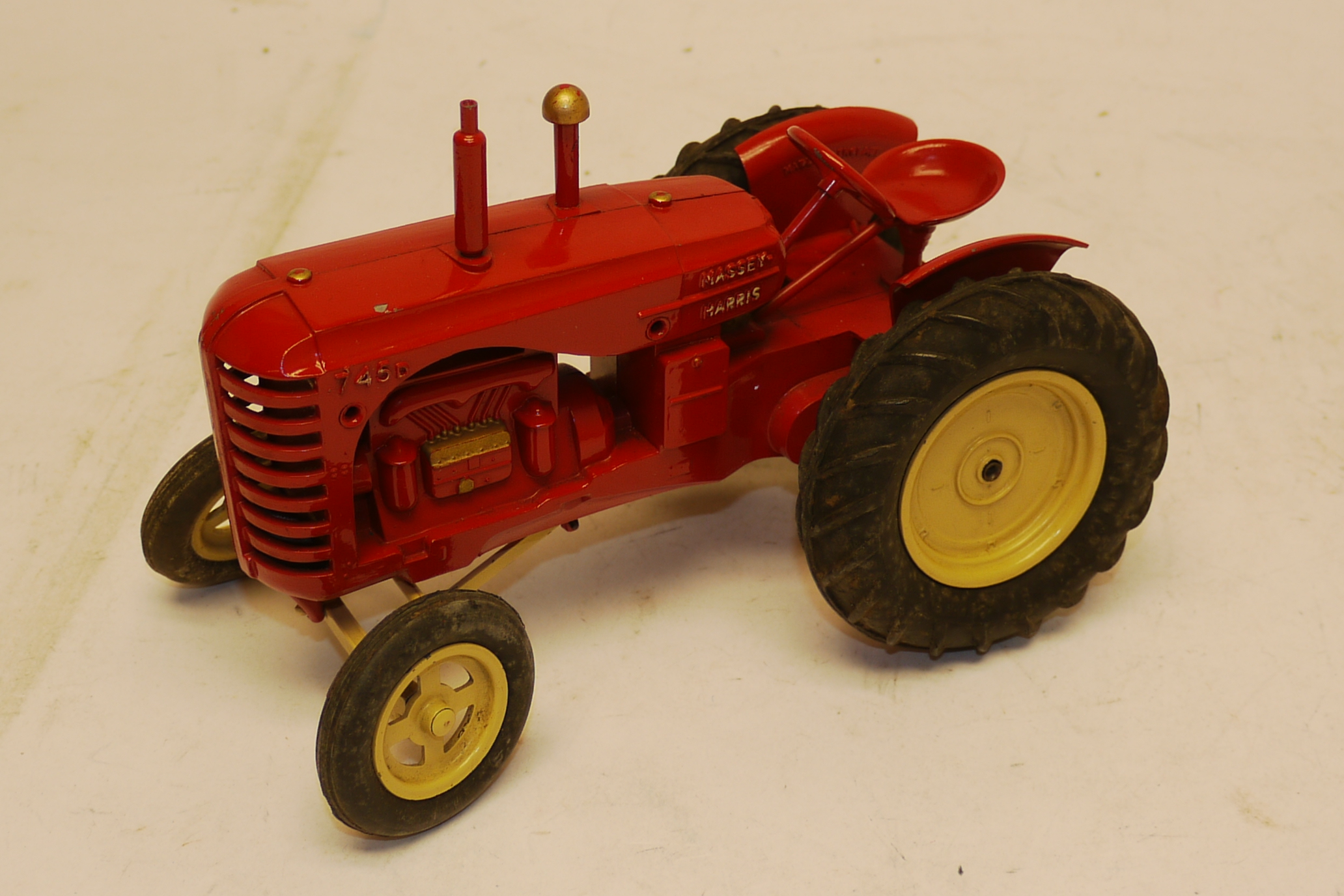 Moko Lesney Tractor, A Moko Lesney Massey Harris 745 D tractor in red livery with rubber tyres
