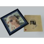 Tom Petty, framed and glazed colour photograph with a signature 38cm square together with the insert