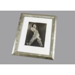 Queen, a pair of Freddie Mercury b/w prints singing on stage framed and glazed (36cm x 45cm)