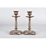 A pair of bronze 19th Century pierced candlesticks, with dentil sconces, 16 cm high