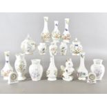 A large collection of Aynsley ceramics, to include vases, bowls, pin trays, etc all with various