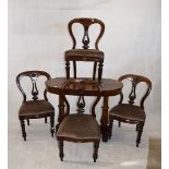 A Victorian mahogany side table and set of four mahogany dining chairs, table on twin turned