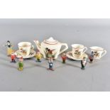 A Wade Heath child's Disney tete a tete, comprising two cups and saucers, teapot and milk jug