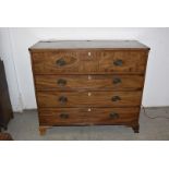 A four drawer chest of drawers, the top drawer being a faux drawer with hinged top, having inlaid