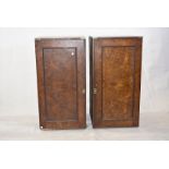 A pair of burr walnut-veneer campaign side cupboards, brass and iron-bound, fitted with linen