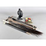 A small group of African tribal items, including a bone handled horse hair fly whip, a tribal