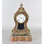A Boulle late 19th century mantle clock and stand, in the Louis XVI style, with French drum eight