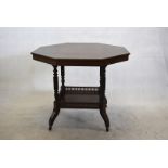 An octagonal two tier occasional table, the top having central inlaid design, on four turned legs,