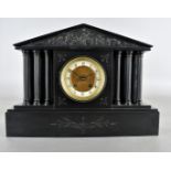 A 19th Century slate architectural mantel clock, with painted columns, arched pediment with