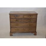 An early 19th Century mahogany chest of drawers, three long and two short graduated drawers, brass