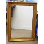 A large rectangular hall mirror, in pine frame, 78 cm x 108 cm