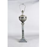 An Edwardian silver plated table lamp, of Corinthian column form with oval reservoir now converted