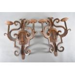 A pair of Art Deco Mexican iron wall brackets, of scroll design, 40cm (2)