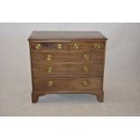 An early 19th Century mahogany chest of drawers, two short and three long graduated drawers, with