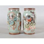 A pair of Meiji period Japanese stoneware celadon glazed sleeve vases, decorated with Japanese