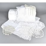 A collection of vintage lace, including various items of damask, and linen table cloths