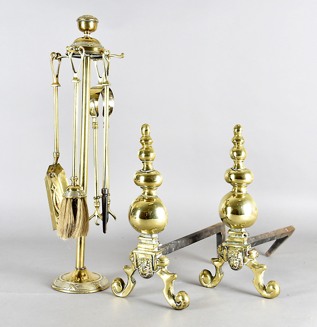 An art nouveau brass fire iron set, with heart shaped handles, ribbon and bow design, together