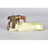 An art deco cold painted bronze and onyx figure group, modelled as a donkey drinking from a