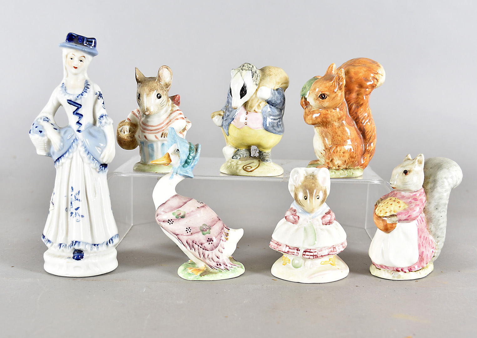 Six Beswick Beatrix Potter figures, including Tommy Brock, Squirrel Nutkin, Jemima Puddle Duck and