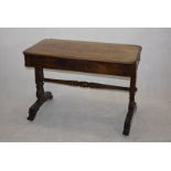 A mahogany side table, having drawer to one long side, on decorative twin legs and scroll feet, with