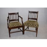 A set of six dining chairs and carver, with column style back splats, floral upholstery, with lower