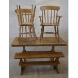 A modern waxed pine kitchen table, pine bench and modern Victorian-style elbow chair and two