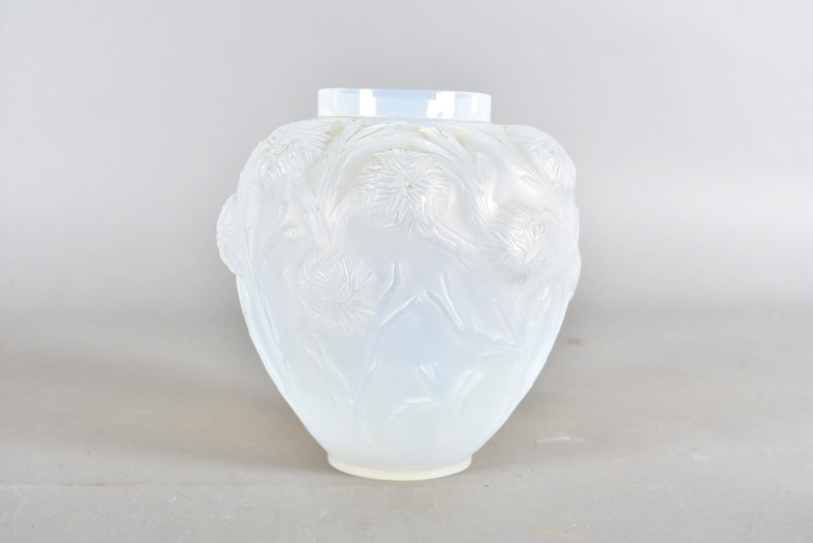 An art deco Sabino opalescent glass vase, with moulded chrysanthemum flowers and stems, of ovoid