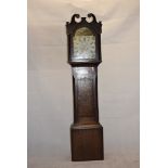 An early 19th Century 8-day longcase clock, with arched painted dial decorated with hunting scene,